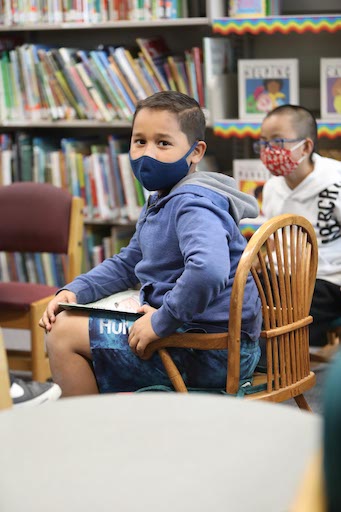 Student posing in the library